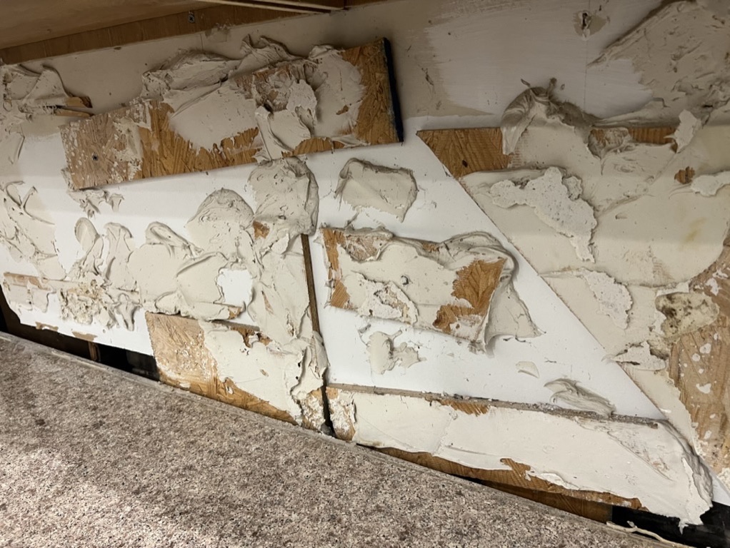 Related views of a finished kitchen backsplash and its working detail