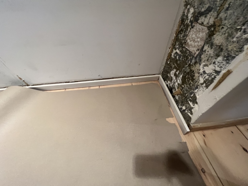 Related views of baseboard installation work
