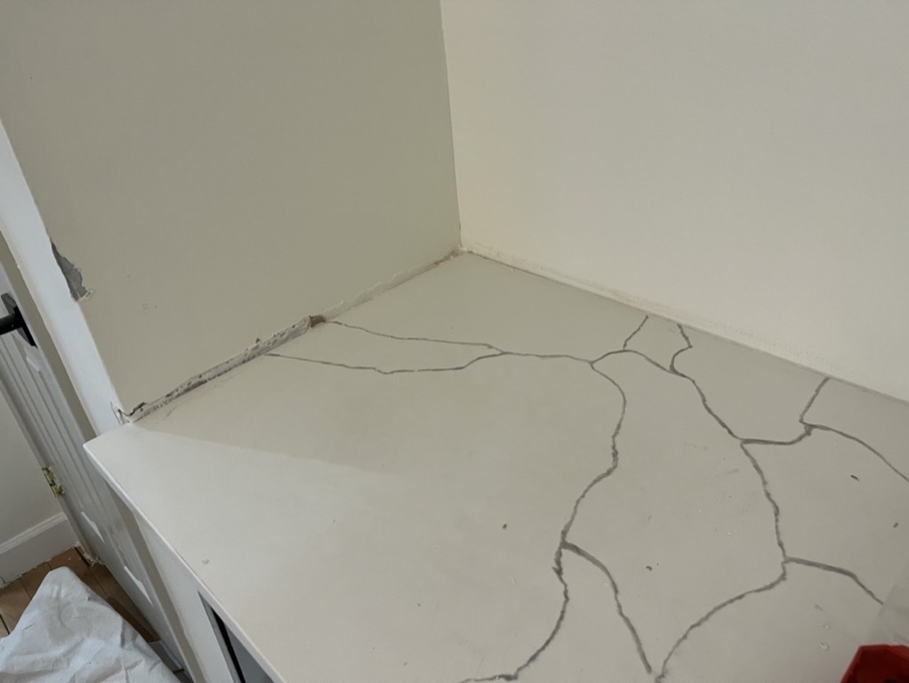 Related views of a countertop and adjacent wall finish area