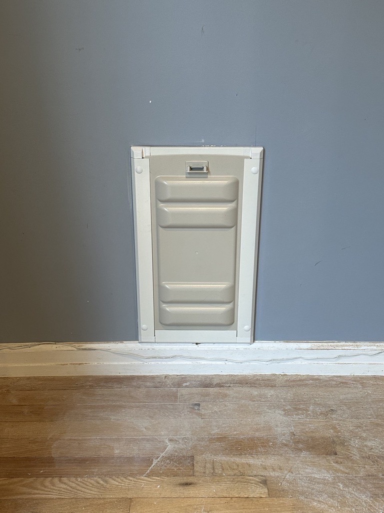 Related views of a pet door installed in an interior wall