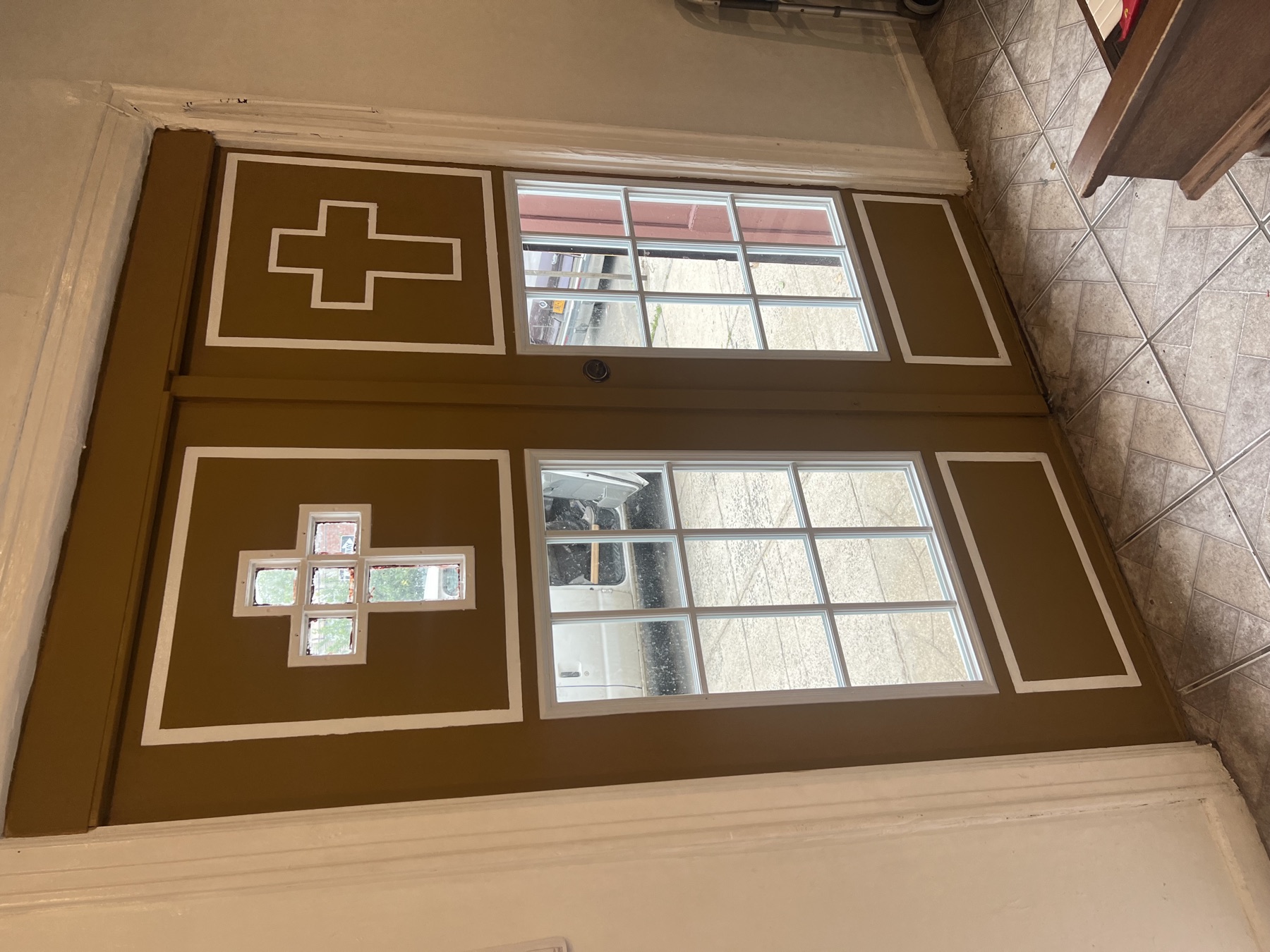Restored double entry doors with finished interior trim