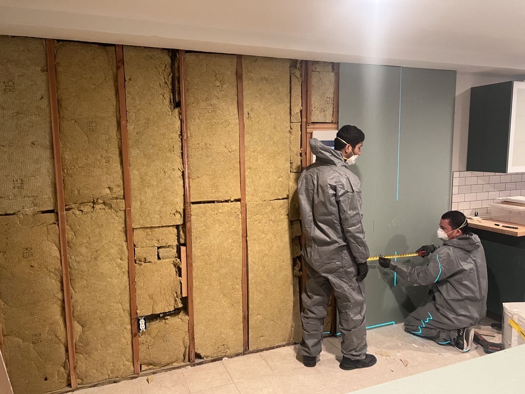 Related views of interior wall rebuild work