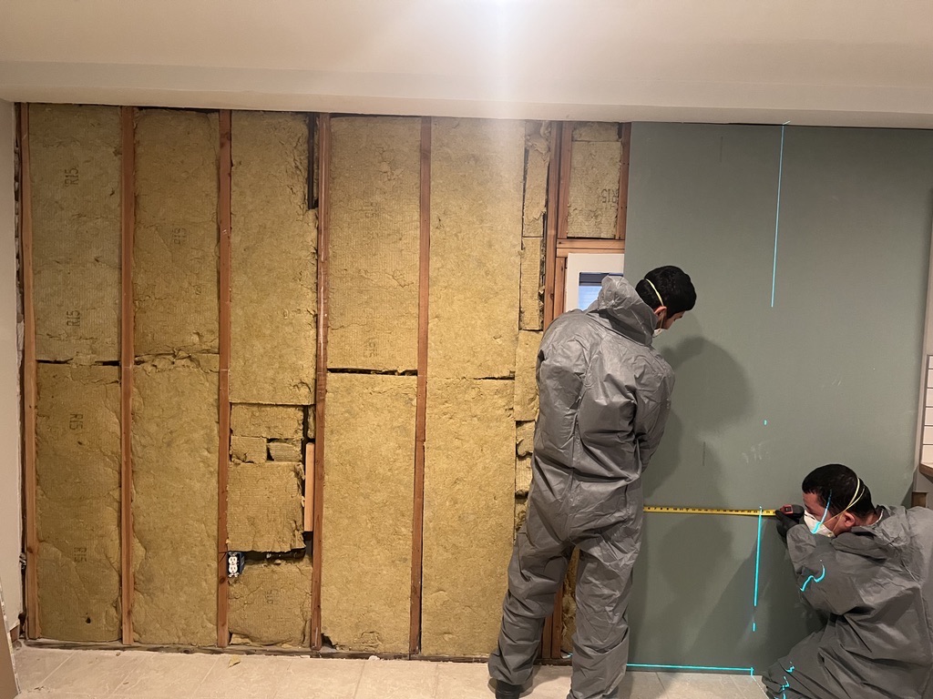 Related views of interior wall rebuild work