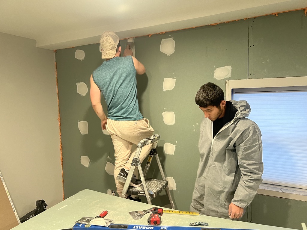 Related views of interior wall rebuild work