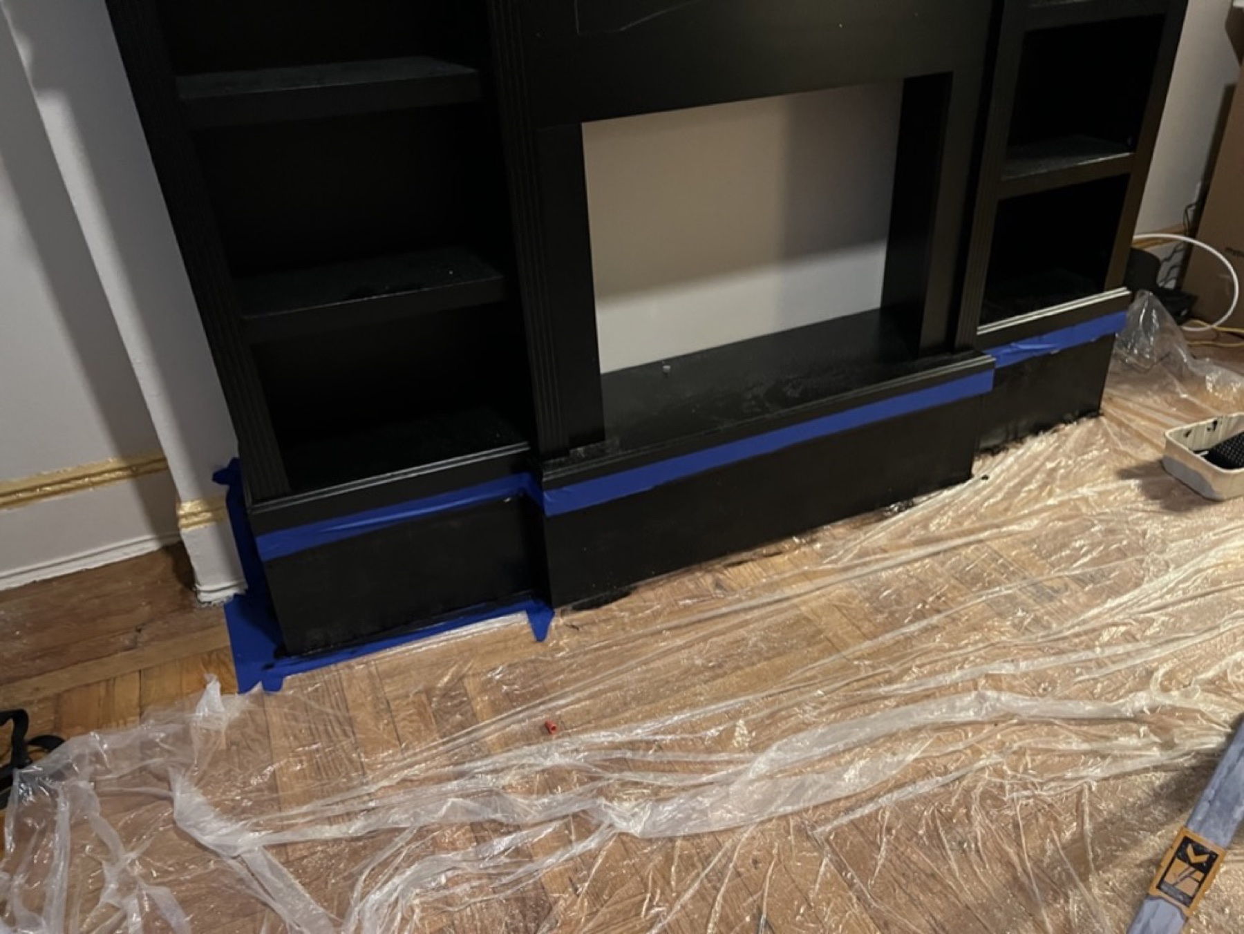 Close view of the new lower riser during paint preparation