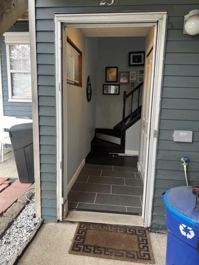 Related views of tile flooring at an entry