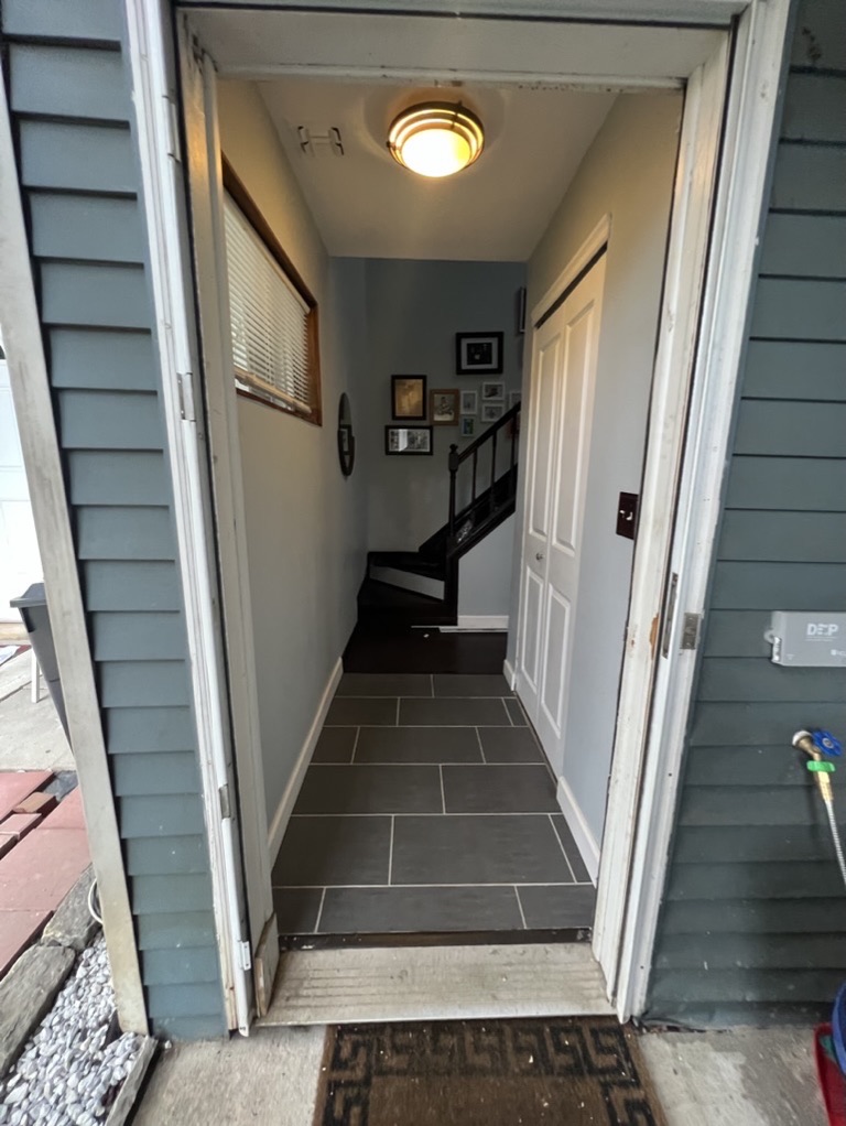 Related views of tile flooring at an entry